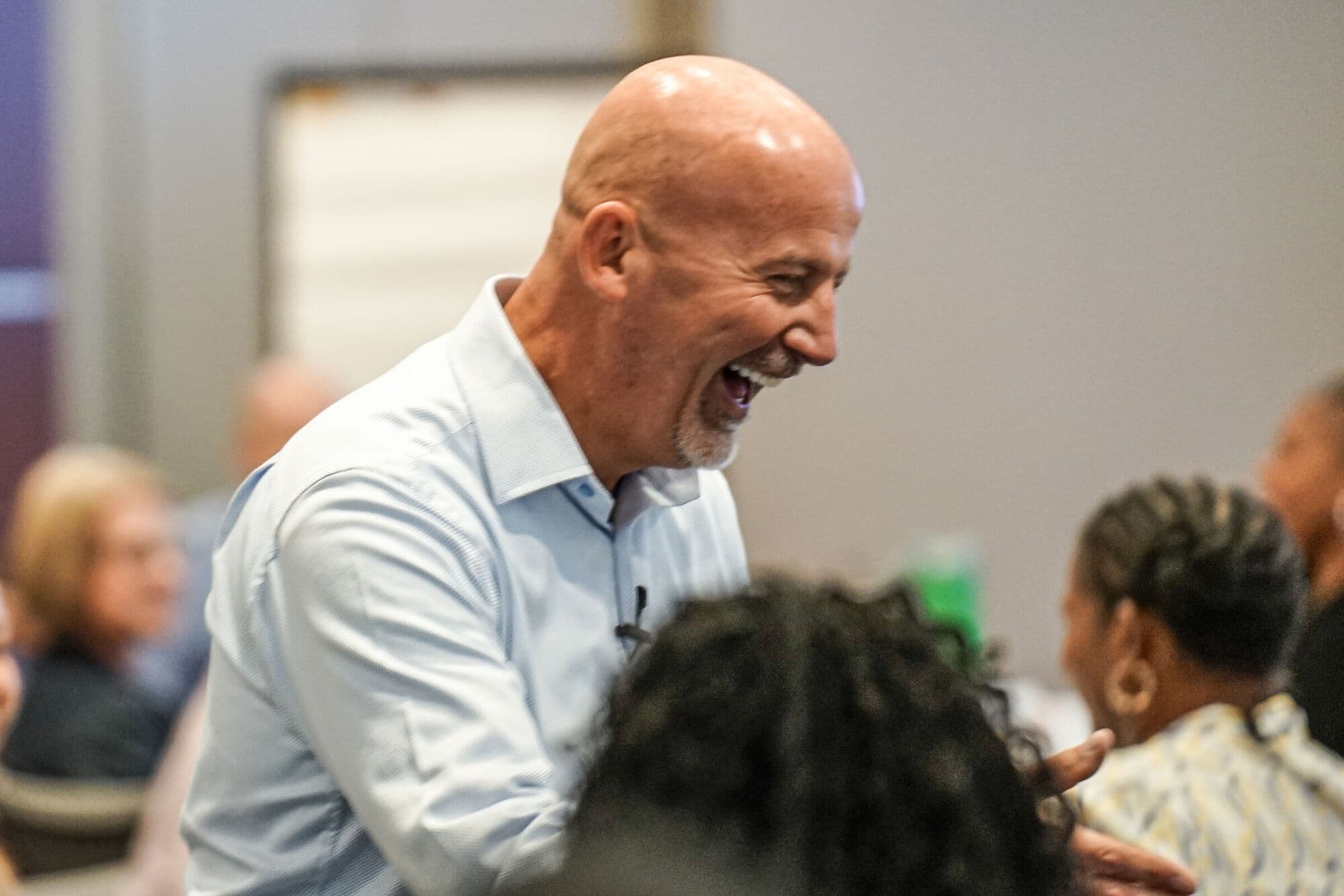 Steve Lowisz laughing during a working session with the Qualigence team